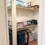 closet with over the door mirror